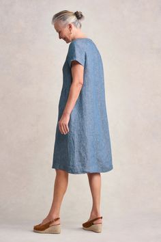 This timeless linen shift dress in Indigo Twill is perfect for lazy summer days. In a new shape for Blue Illusion with a short sleeve and scoop neckline, this dress is crafted from a comfortable hemp linen blend. C’est joli! Indigo Mini Length Cotton Dress, Indigo Knee-length Denim Dress, Indigo V-neck Cotton Dress, Indigo Knee-length Relaxed Fit Denim Dress, Indigo Relaxed Fit Knee-length Denim Dress, Lazy Summer Days, Linen Shift Dress, Spring Wear, Work Wear Women