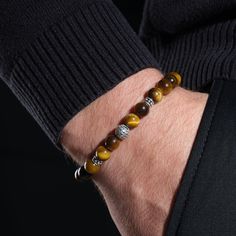 Meet our exquisite Tiger Eye Crystal Bracelet, perfect for men and an ideal gift for your boyfriend's birthday. This stunning handmade bracelet is meticulously crafted using real tiger eye gemstones, known for their unique patterns and ethereal properties. Our tiger eye bracelet not only adds a touch of style to any outfit, it also offers healing and energy-boosting benefits. Believed to promote courage, confidence and focus, tiger eye is a popular choice for men looking to increase their inner Elegant Brown Bracelets For Friendship, Elegant Brown Friendship Bracelet, Elegant Brown Bracelet, Boyfriend's Birthday, Real Tiger, Mens Stretch Bracelets, Eye Natural, Bracelet Christmas, Tiger Eye Crystal