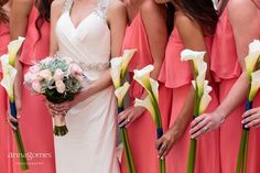 the bride and her bridesmaids are all wearing pink dresses