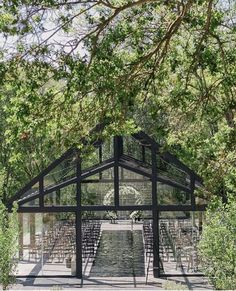 an artist's rendering of the inside of a glass house surrounded by greenery