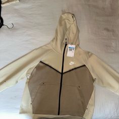 Brand New With Tags. Loose Fit. Sporty Beige Hoodie With Pockets, Sporty Cream Sweatshirt With Pockets, Cream Sporty Sweatshirt With Pockets, Sporty Cream Hoodie With Pockets, Nike Casual Outdoor Hoodie, Nike Winter Fleece Hoodie Jacket, Nike Casual Hoodie For Outdoor Activities, Sporty Beige Fleece Hoodie, Beige Sporty Fleece Hoodie