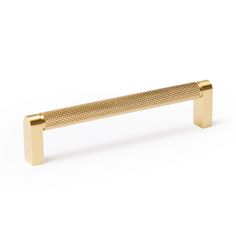 a gold metal handle on a white background