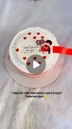 a white cake with hearts on it and a red ribbon around the edge that says create the trending love cake