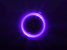 an image of a purple ring in the dark