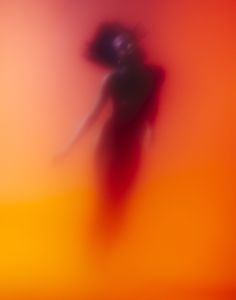 a blurry image of a person with an umbrella