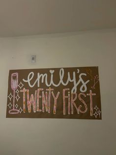 a sign that says jenny's twenty first hangs on the wall