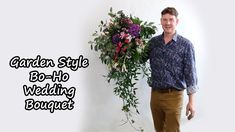 a man standing in front of a white wall with flowers on it and the words garden style bo - fi wedding bouquet