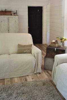 a living room with two couches and a coffee table