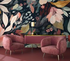 two pink chairs in front of a floral wallpaper with gold accents and a side table