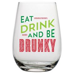 a wine glass with the words eat drink and be drunk written in red on it