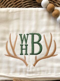 the embroidered monogrammed towel has antlers on it