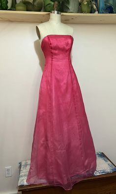 "Vintage 60s strawberry pink satin evening gown with rhinestone trim. Great colors/shape. Nice vintage condition with wear thats consistent with age. Please see photos for reference.   Pit to pit 14\" Waist 13.5\" Length 48\" Sweep 40\"" Pink A-line Evening Gown, Pink Silk A-line Evening Dress, Pink A-line Gown For Evening, Pink A-line Evening Dress For Formal Occasions, Pink A-line Gown With Fitted Bodice, Pink Satin Gown For Debutante Ball, Pink A-line Gown For Formal Occasions, Pink Full-length Prom Gown, Pink Full-length Gown For Prom