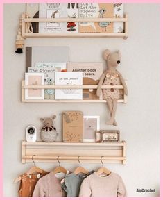 two wooden shelves with books and stuffed animals on them in a child's room