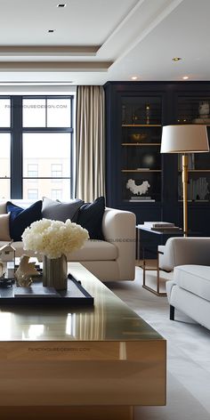 a living room filled with furniture and a large window covered in curtains next to a coffee table