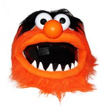 an orange and black furry animal head with teeth, eyes, and mouth shapes on it's face