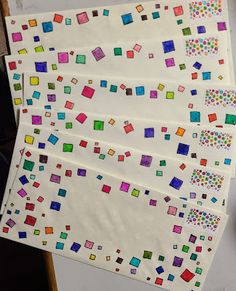 four pieces of paper with colored squares on them