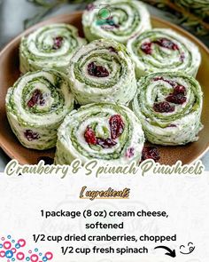 a plate filled with cranberry and spinach pinwheels