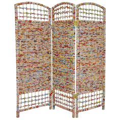 a room divider made out of woven material with multiple colored circles on the sides