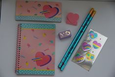 an assortment of stationery items displayed on a table