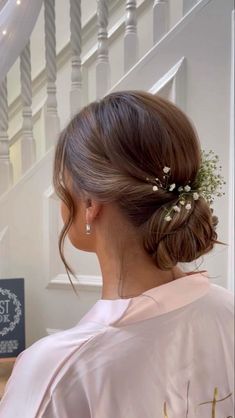 a woman with a flower in her hair is looking down at the stairs and staircases