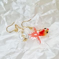 🍀 Size: 7 x 1.8 cm 🍀 Material: 14K Gold Plated Sterling Silver Hook, Glass, Resin (✨Hypoallergenic Hook✨) Description  🌸 Dive into the world of whimsy with our Kawaii Japanese Goldfish and Glass Tank Earrings! These funky dangle & drop earrings capture the charm of a serene fish tank. A unique and creative piece of jewelry, perfect as a gift for Mom or Her, they add a touch of cuteness and creativity to any outfit. 🌸 ⭐️ Shop more styles at https://etsy.com/uk/shop/StrawberryAtoll. ⭐️ * Shipp Handmade Fish-shaped Earrings For Gifts, Fish Hook Drop Earrings As A Gift, White Fish Hook Earrings As Gift, Drop Earrings Jewelry With Fish Hook As Gift, Elegant Gold Fish-shaped Earrings, Gold Fish-shaped Earrings With Fish Hook, Gold Fish-shaped Earrings, Gold Fish-shaped Pierced Earrings, Japanese Fish