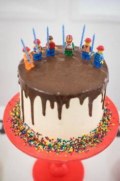 a birthday cake with chocolate icing and sprinkles