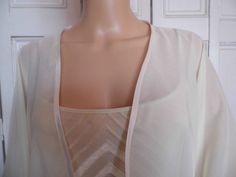 This is a beautiful hand made chiffon kimono ideal as a cover-up for weddings or special occasions. It has a satin edging It can be made in any size from 8 to 24 (UK sizes). It is made in the UK. It is normally sent out to you within 5 days, but I am very happy to make your order a priority if you need it urgently. Just let me know the date needed by. Postage is free in the UK! International postage is £9. I am happy to exchange items or refund your payment if you are less than happy with the pr Elegant Fitted Summer Kimono, Elegant Open Front Layering Shrug, Elegant Open Front Shrug For Layering, Elegant Open Front Summer Shrug, Elegant Fitted Open Front Kimono, Elegant Open Front Shrug For Spring, Elegant Spring Wrap Shrug, Elegant Cream Summer Kimono, Chiffon Kimono Jacket