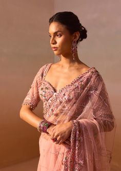 Capture elegance with this rose pink net sari adorned with metallic rose gold and gray sequins, complemented by intricate beaded embroidery. Complete the look with an elbow-length, fully embroidered sleeveless blouse, perfect for a sophisticated and glamorous ensemble. Net Sari, Pink Sari, Metallic Rose Gold, Pink Fabric, Rose Pink, Sleeveless Blouse, Beaded Embroidery, Passion For Fashion, Design Crafts