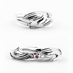 "This is a solid sterling silver Fede or Claddagh, gimmel style ring. The name \"fede\" is from the Italian phrase mani in fede (\"hands clasped in faith\"). The clasped hands open up to reveal a heart with a genuine, natural faceted ruby pavé set in the center. A gimmal ring, or gimmel ring, is a ring with two or three rings that fit together to form one ring, joined together in unity. A beautiful take on a traditional design used for centuries to show love and friendship. Handmade to order." Promise Heart Ring In Sterling Silver With Polished Finish, Sterling Silver Heart Ring With Polished Finish For Promise, Sterling Silver Heart Promise Ring, Symbolic Sterling Silver Stackable Promise Rings, Fine Jewelry Sterling Silver Heart Ring With Polished Finish, Cladaggah Ring, Sterling Silver Heart Ring With Polished Finish, Gothic Hand Cast Ring Jewelry, Ruby Claddagh Ring