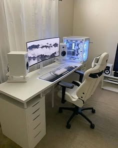 a computer desk with two monitors and a keyboard