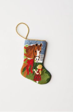 a christmas stocking ornament with a horse on it