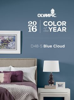 an advertisement for the olympic color of the year, featuring a bed with purple and white sheets