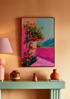 a painting hanging on the wall above a table with two vases and a lamp