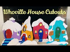 paper cut out of houses with snow on the roof and below that reads, whirlie house curiouss