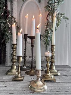 a group of candles sitting on top of a wooden table