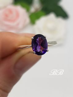 "Made to order.  Please allow up to 3 weeks for the production of your ring. This listing is for a 925 non-plated sterling silver or gold solitaire ring made with your choice in size of a natural purple amethyst gemstone. Available Amethyst Dimensions 7x5mm, 1 Carat Approximately 8x6mm, 1.5 Carat Approximately 9x7mm, 2 Carat Approximately 10x8mm, 2.5 Carat Approximately 11x9mm, 4 Carat Approximately 12x10mm, 5 Carat Approximately 14x10mm, 6 Carat Approximately 16x12mm, 9 Carat Approximately ** Sizes 10x8mm and up will have split shank like this setting - www.etsy.com/listing/1533484985 Gem Type: Natural Amethyst Shape: Oval Cut Size: Your Choice Color: Purple Quality: AAA Hardness: 7 Mohs Metal Choices (All metals are solid and non-plated) 925 Sterling Silver 10kt & 14kt White Gold (non-rh Luxury Timeless Oval Amethyst Ring, Oval Amethyst Solitaire Jewelry, Classic Oval Amethyst Ring For Gift, Oval Solitaire Amethyst Ring Gift, Oval Solitaire Amethyst Ring, Oval Amethyst Ring With Prong Setting, Adjustable Oval Purple Amethyst Ring, Oval Amethyst Rings With Polished Finish, Solitaire Amethyst Ring In Yellow Gold, Oval Shape