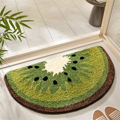 a watermelon rug on the floor next to shoes