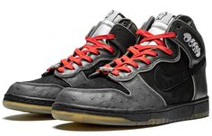 The Nike Dunk High SB Skateboard Premium 'MF Doom' is a special edition shoe that was created in collaboration with the acclaimed underground rapper. The high-top shoe is made of black suede with Midnight Fog leather overlays and features reflective piping. It also has 'Doom' embroidery on the collar and a faux ostrich skin on the toe wrap. The tongue tabs feature an MF Doom mask graphic, while the laces are red for a bold contrast. The sockliner and outsole also feature MF Doom artwork. Mf Doom Shoes, Doom Artwork, Mf Doom Mask, Nike Sb Dunk High, Sb Dunk High, Mf Doom, Dunk High, Nike Dunk High