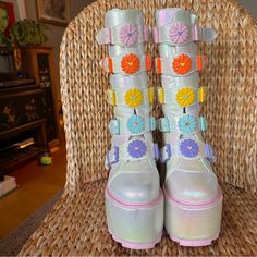 Yru White Holo Rainbow Daisy Dune Boots Size 8 Womens = 7 Mens Heel Height 6” Platform 3” Buckle On Both Sides Back Zip In White Lilac , Baby Blue, Yellow, Orange & Pink Pink Trim And Soles Small Blemish On Front Of Right Boot Platform And Inside Of Left Boot And Also The Toe But Super Light. There Are A Few Scrapes And Dings But They Are Basically Invisible But Thought I Should Mention. Please Ask More Questions If You Have Them As All Sales Are Final. #Holographic #Daisies #Summer2023 #Festival Rainbow Daisy, Yru Shoes, Yellow Orange Pink, Men In Heels, White Lilac, Blue Yellow Orange, Pink Trim, Pink Pink, Platform Boots