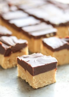 several pieces of cake sitting on top of a counter