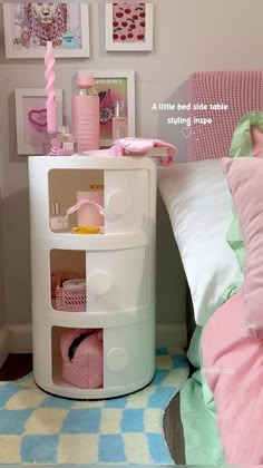 a bedroom with pink and green decor on the walls, bedding and accessories are neatly organized