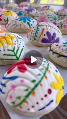 colorful decorated donuts sitting on top of a table