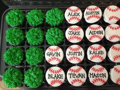 cupcakes decorated with green frosting and baseball balls are displayed in a tray