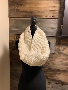 Looking for a fabulous winter look?  Then you have found it here with this scarf.  This cream coloured infinity scarf is soft, warm and stylish.  It will keep away the chill.  Made with a soft cream blended yarn(20% wool), it is machine washable.  Lay flat to dry. One-size Knit Infinity Scarf, One Size Yarn Infinity Scarf, Knit Infinity Scarf One Size, Knitted Acrylic Infinity Scarf One Size, One Size Knitted Acrylic Infinity Scarf, Knitted Acrylic Infinity Scarf, Hand Knitted One-size Infinity Scarf, Hand Knitted One Size Infinity Scarf, Knitted One Size Infinity Scarf