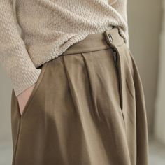 Details: Gender: Women Item Type: Skirt Material: Wool Season: Spring, Autumn Pattern: Solid Style: Casual, Loose, Retro Waist Type: Elastic Waist Size: One Size Waist: 64.00 - 84.00 cm/ 25.20 - 33.07 " Length: 77.00 cm/ 30.31 " Hip: 126.00 cm/ 49.61 " Hem: 184.00 cm/ 72.44 " Beige Winter Midi Skirt, Winter Midi Skirt In Solid Color, Khaki Skirt For Workwear, Relaxed Khaki Skirt For Fall, Winter Beige Lined Skirt, High Waist Pleated Skirt For Winter, Fall Beige Long Skirt, Fall Long Khaki Skirt, Fall Pleated Khaki Bottoms