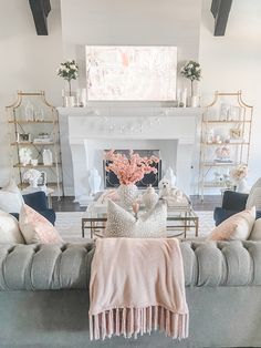 a living room filled with furniture and a fire place