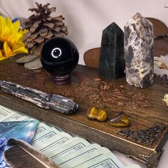 a wooden table topped with lots of different types of rocks and stones on top of it