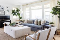 a living room filled with furniture and a piano