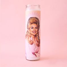 A tall glass prayer candle. On the front is a picture of Dolly Parton with long blonde hair and a pink jacket. Dolly Parton Gifts, Prayer Candles, Dumpster Fire, North Park, Darren Criss, Candle Diffuser, Home Candles, Dolly Parton, Glass Jar