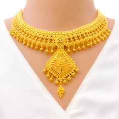 This 22k gold necklace set features an imperial vintage charm design, perfect for adding elegance to any outfit. Weighing 75.5 grams, it showcases a yellow gold finish that enhances its intricate and regal appearance. The set has a length of 17 inches with a 2.5-inch drop and includes adjustable 1.5-inch links for a comfortable fit. Secured with a hook lock, it combines style and practicality. The matching earrings, each 2.3 inches long, feature screw back posts for added security. Ideal for tho 22k Gold Necklace Set, 22k Gold Necklace, Bridal Necklace Designs, Bridal Jewelry Necklace, Diamond Pendant Sets, Lock It, Fancy Necklace, Fancy Rings, Mens Gold Rings